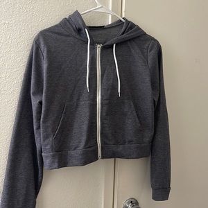 This is a Cropped Zip Up sweater.